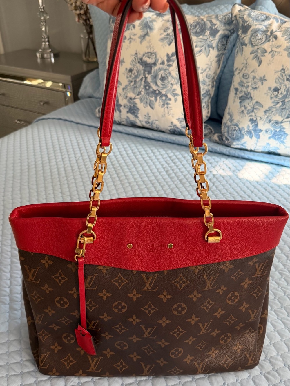 Louis Vuitton Pallas Shopper Tote in Monogram with Red trim.